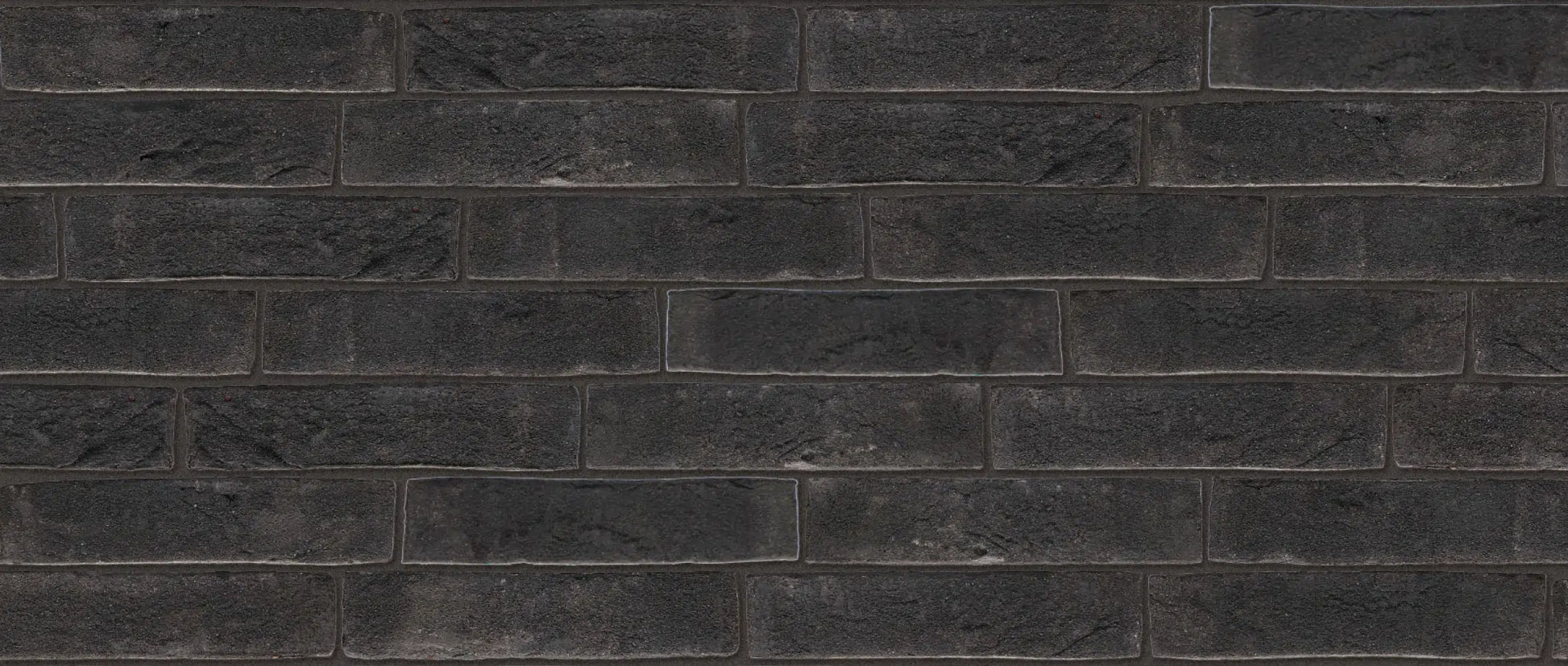 Ladrillo Soft Mud Agora Graphite Black para fachada oscura artesanal